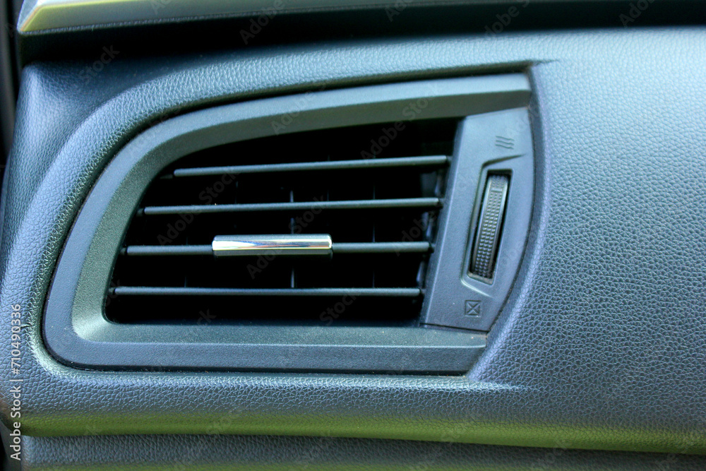 close up of car air conditioning dashboard vent
