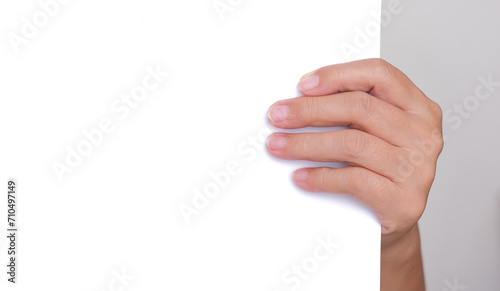 close up shot of hand holding white blank paper photo
