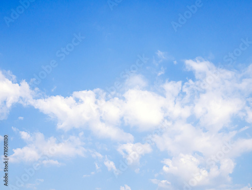 blue sky background with tiny white clouds