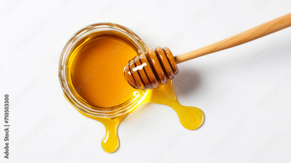 Honey splash and wooden dipper isolated on a white background. Honey splash and wooden dipper isolated on a white background.