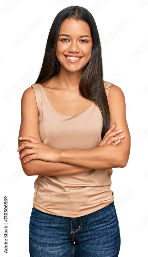 Beautiful hispanic woman wearing casual clothes happy face smiling with crossed arms looking at the camera. positive person. Beautiful hispanic woman wearing casual clothes happy face smiling with crossed arms looking at the camera. positive person.