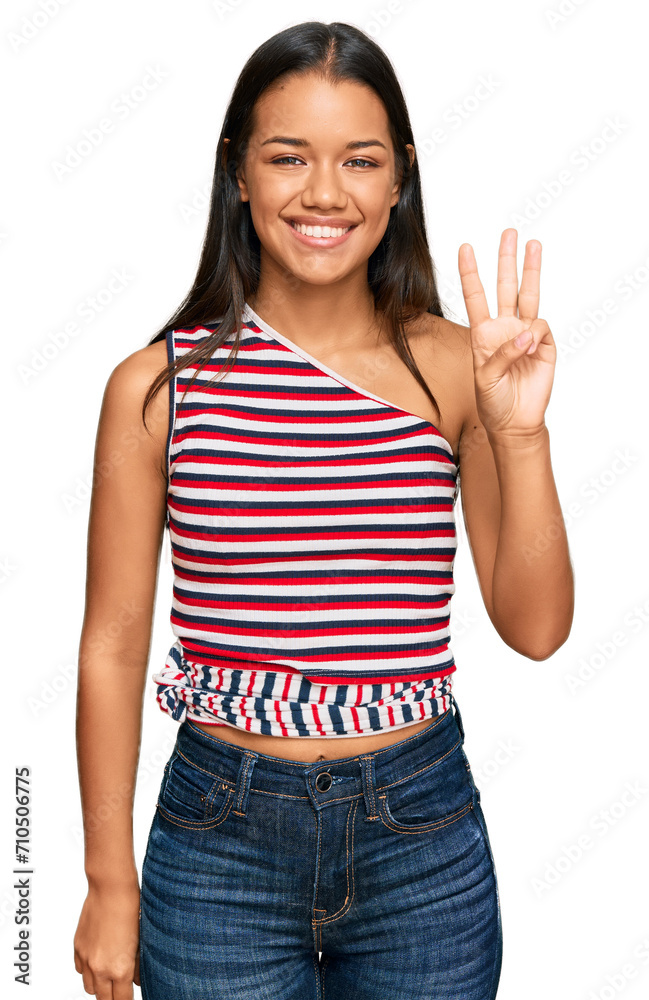 Beautiful hispanic woman wearing casual clothes showing and pointing up with fingers number three while smiling confident and happy. Beautiful hispanic woman wearing casual clothes showing and pointing up with fingers number three while smiling confident and happy.