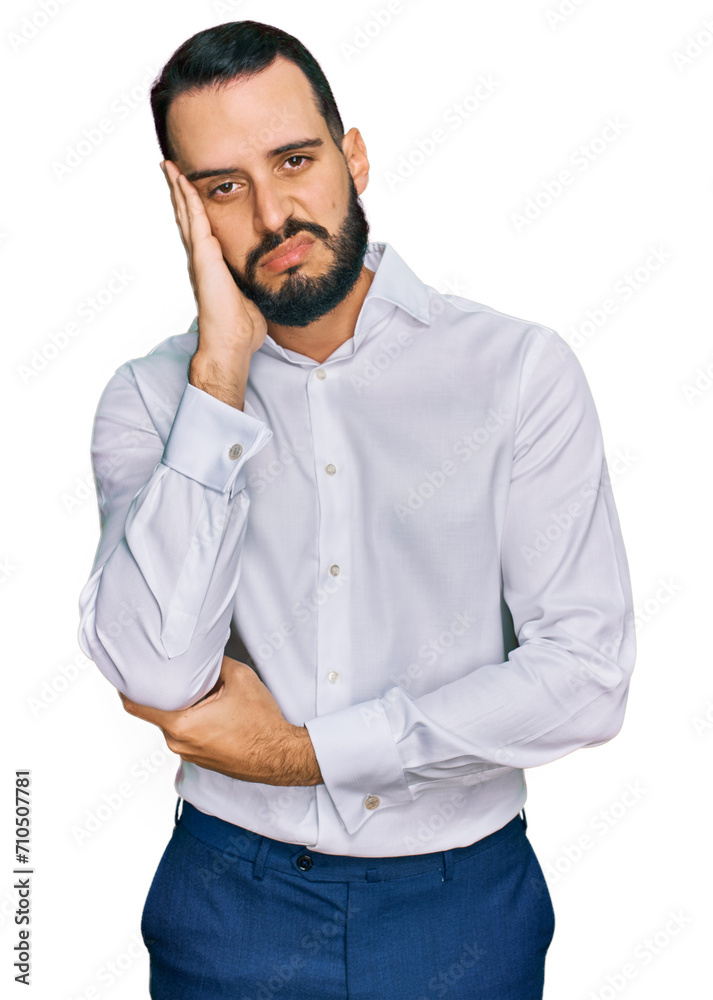 Young man with beard wearing business shirt thinking looking tired and bored with depression problems with crossed arms. Young man with beard wearing business shirt thinking looking tired and bored with depression problems with crossed arms.