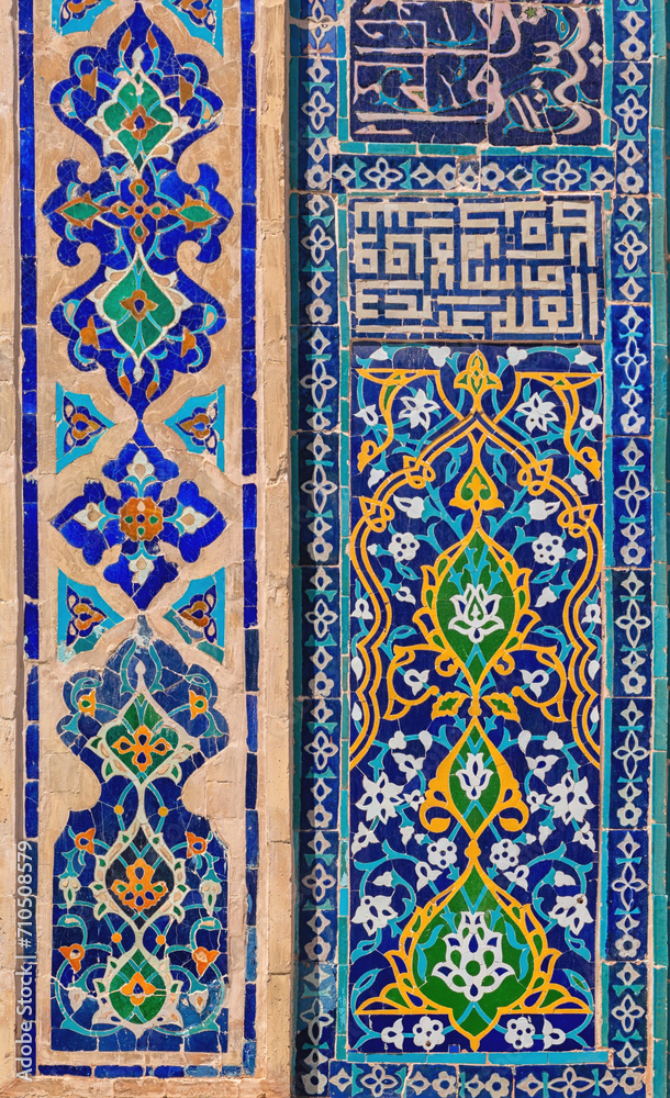 Traditional Uzbek pattern on the ceramic tile on the wall of the madrasah. Vertical. Registan, Samarkand, Uzbekistan