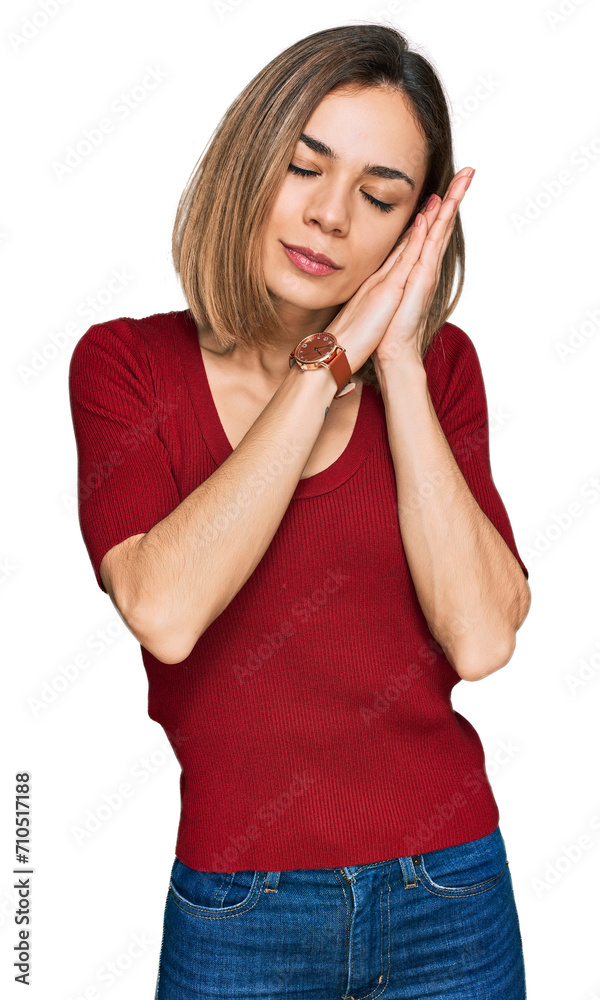 Young blonde girl wearing casual clothes sleeping tired dreaming and posing with hands together while smiling with closed eyes. Young blonde girl wearing casual clothes sleeping tired dreaming and posing with hands together while smiling with closed eyes.