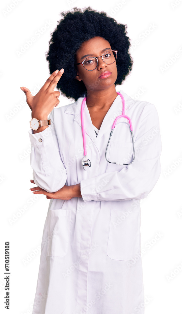Young african american woman wearing doctor coat and stethoscope shooting and killing oneself pointing hand and fingers to head like gun, suicide gesture. Young african american woman wearing doctor coat and stethoscope shooting and killing oneself pointing hand and fingers to head like gun, suicide gesture.