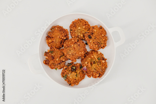 Crispy fried lentil fritters,Parippu ,dal, paripu vada. savoury fried snack also called dal vada, vadai or Masala vada  popular Indian street food and a tea time snack, called Paruppu Vadai photo