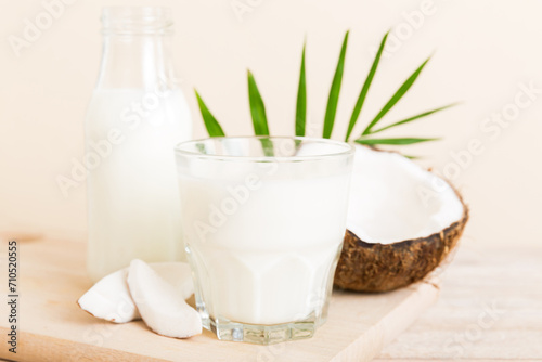 coconut products on white wooden table background. Dairy free milk substitute drink, Flat lay healthy eating