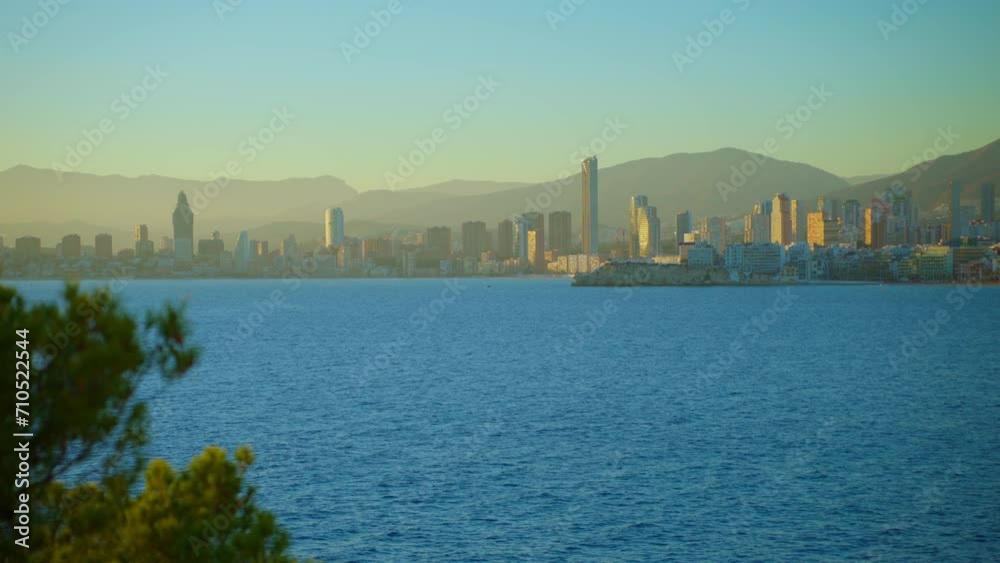 Establishing aerial view of Benidorm skyline skyscrapers hotels and resorts, Benidorm seaside coastline. Aerial view of skyscrapers and beach of the touristic city of Benidorm in the Spain Establishing aerial view of Benidorm skyline skyscrapers hotels and resorts, Benidorm seaside coastline. Aerial view of skyscrapers and beach of the touristic city of Benidorm in the Spain