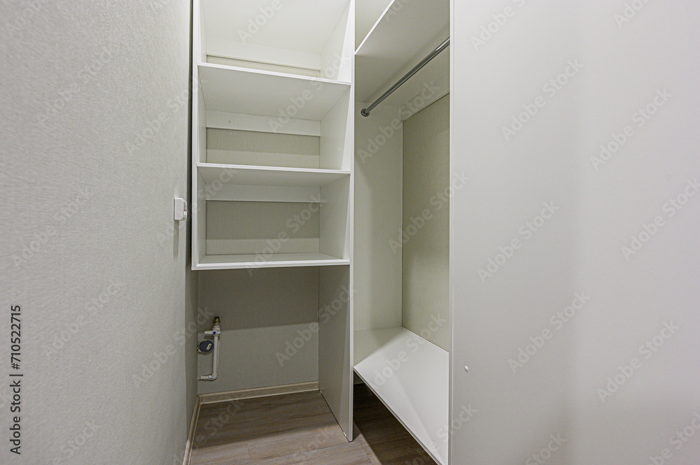 Fototapeta premium interior apartment room dressing room, hangers, storage system