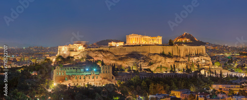 View of the Acropolis of Athens at night, a ruins complex of Greek Temples on hilltop in Athens downtown, Greece. photo