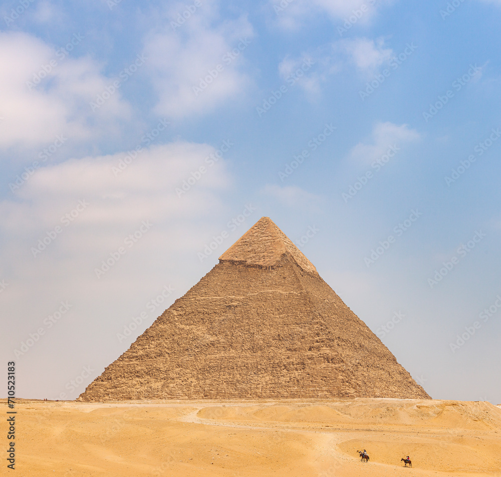 View of The Giza Necropolis, Famed archaeological site featuring the Great Pyramids, the Great Sphinx and The Great Pyramid of Giza in the desert of Giza, Cairo, Egypt. View of The Giza Necropolis, Famed archaeological site featuring the Great Pyramids, the Great Sphinx and The Great Pyramid of Giza in the desert of Giza, Cairo, Egypt.