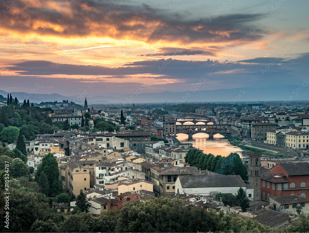 View of Florence downtown at sunset, view of Ponte Vecchio bridge crossing the Arno river, view from Michelangelo square, Tuscany, Italy. View of Florence downtown at sunset, view of Ponte Vecchio bridge crossing the Arno river, view from Michelangelo square, Tuscany, Italy.