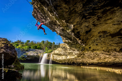 View of a Climber next to a waterfall in Central Istria, in Croatia. photo