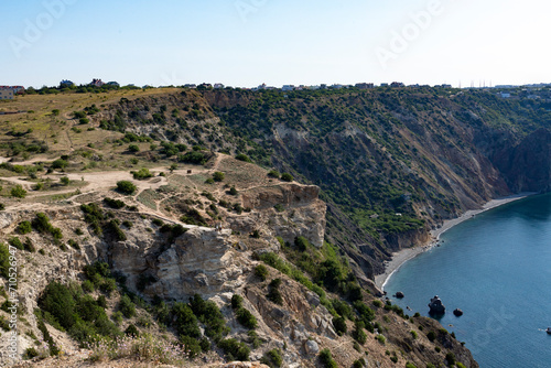 Coastal sea rocks. View of the sea cliffs sea and sky from a height.