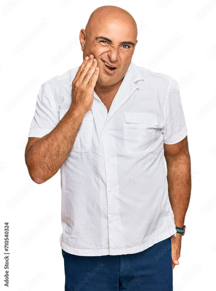 Mature middle east man with mustache wearing casual white shirt touching mouth with hand with painful expression because of toothache or dental illness on teeth. dentist Mature middle east man with mustache wearing casual white shirt touching mouth with hand with painful expression because of toothache or dental illness on teeth. dentist