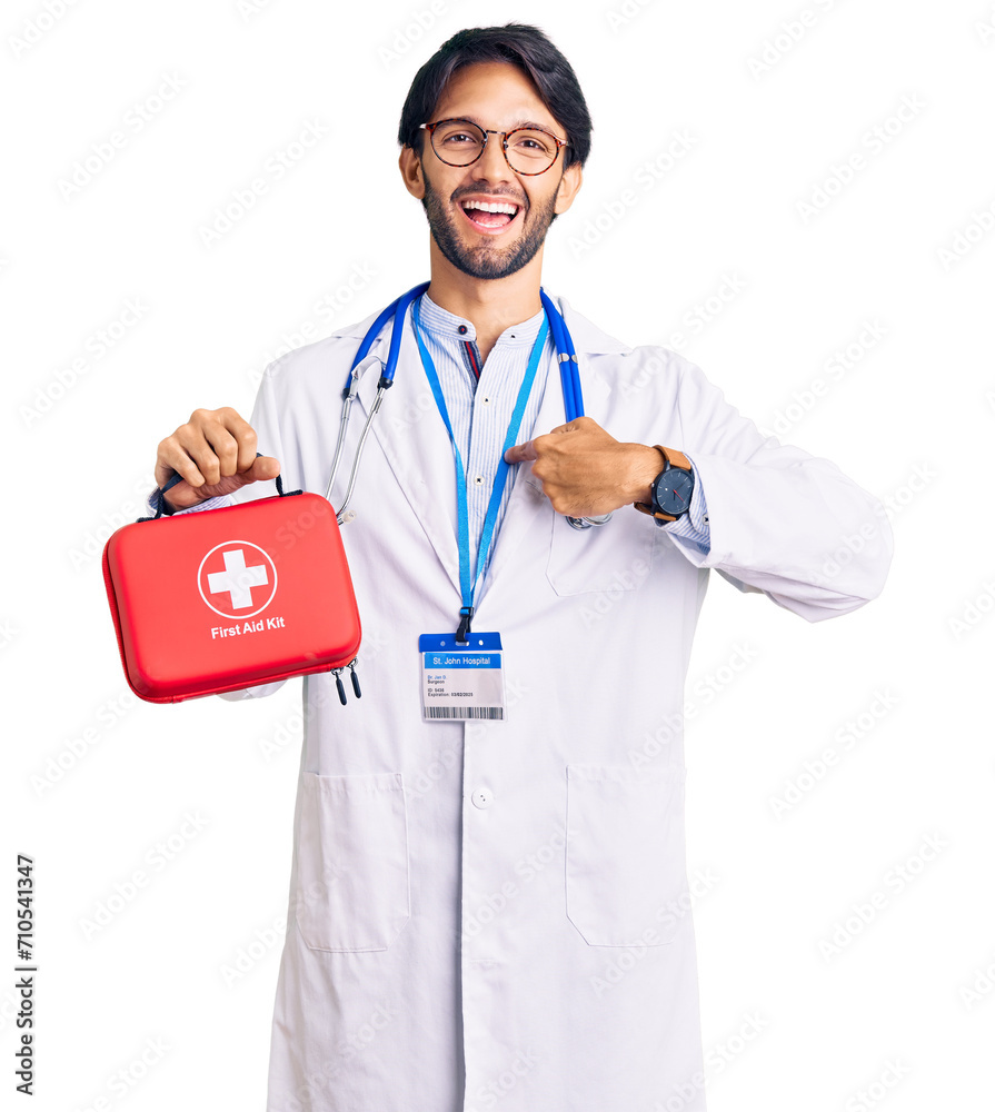 Handsome hispanic man wearing doctor coat holding first aid kit pointing finger to one self smiling happy and proud Handsome hispanic man wearing doctor coat holding first aid kit pointing finger to one self smiling happy and proud