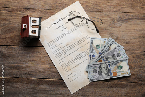 Last Will and Testament, house model, dollar bills and glasses on wooden table, flat lay