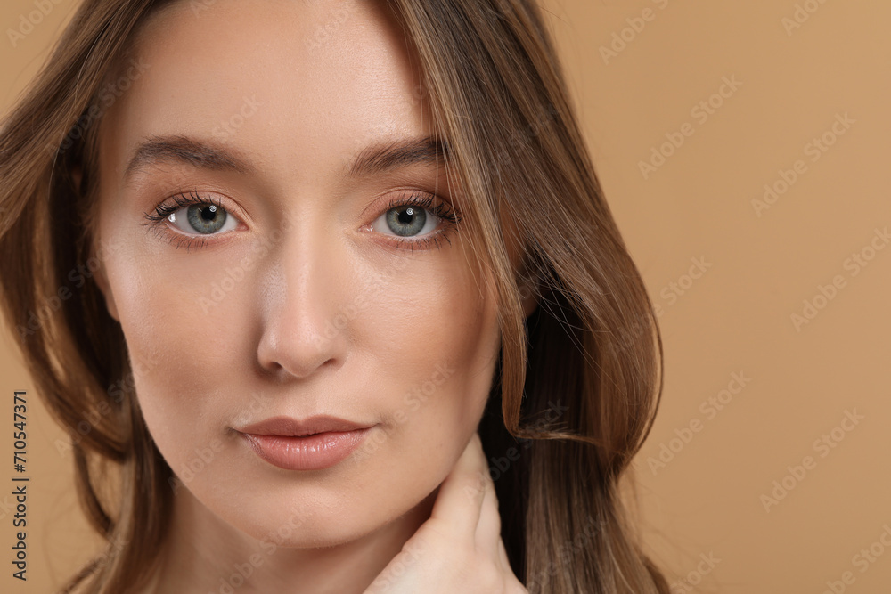 Beautiful woman with healthy skin on beige background, closeup Beautiful woman with healthy skin on beige background, closeup