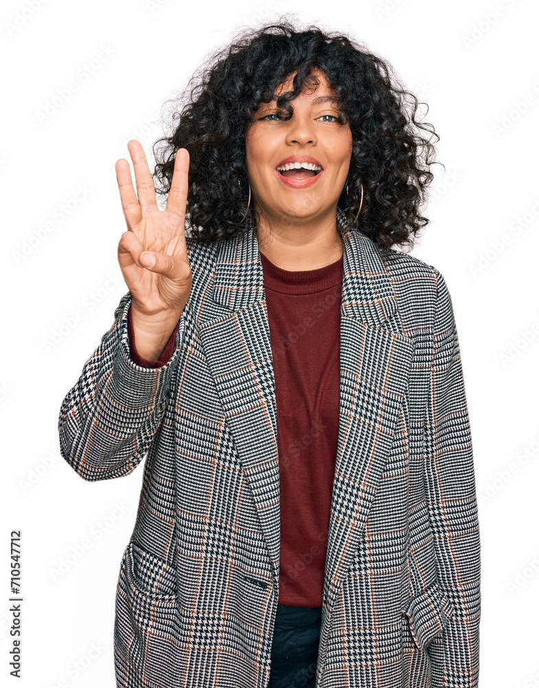 Young hispanic woman wearing business clothes showing and pointing up with fingers number three while smiling confident and happy. Young hispanic woman wearing business clothes showing and pointing up with fingers number three while smiling confident and happy.
