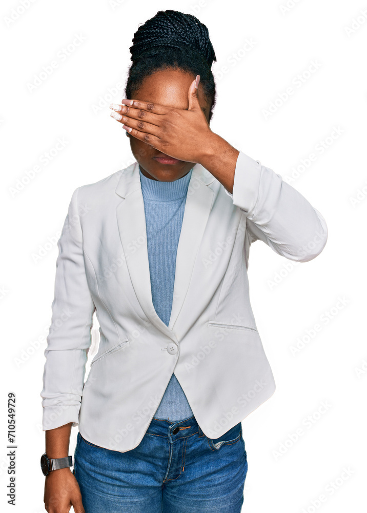 Young african american woman wearing business clothes covering eyes with hand, looking serious and sad. sightless, hiding and rejection concept Young african american woman wearing business clothes covering eyes with hand, looking serious and sad. sightless, hiding and rejection concept