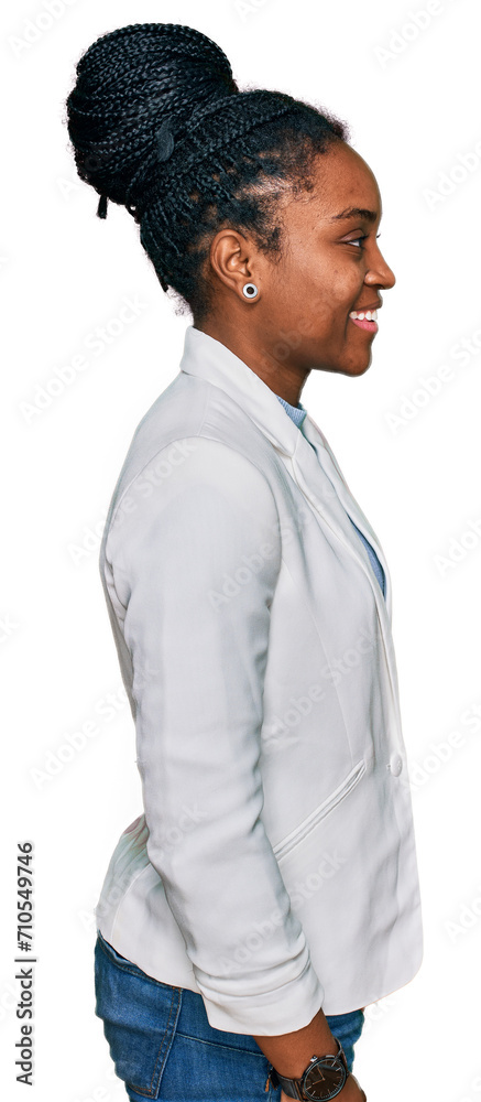 Young african american woman wearing business clothes looking to side, relax profile pose with natural face and confident smile. Young african american woman wearing business clothes looking to side, relax profile pose with natural face and confident smile.