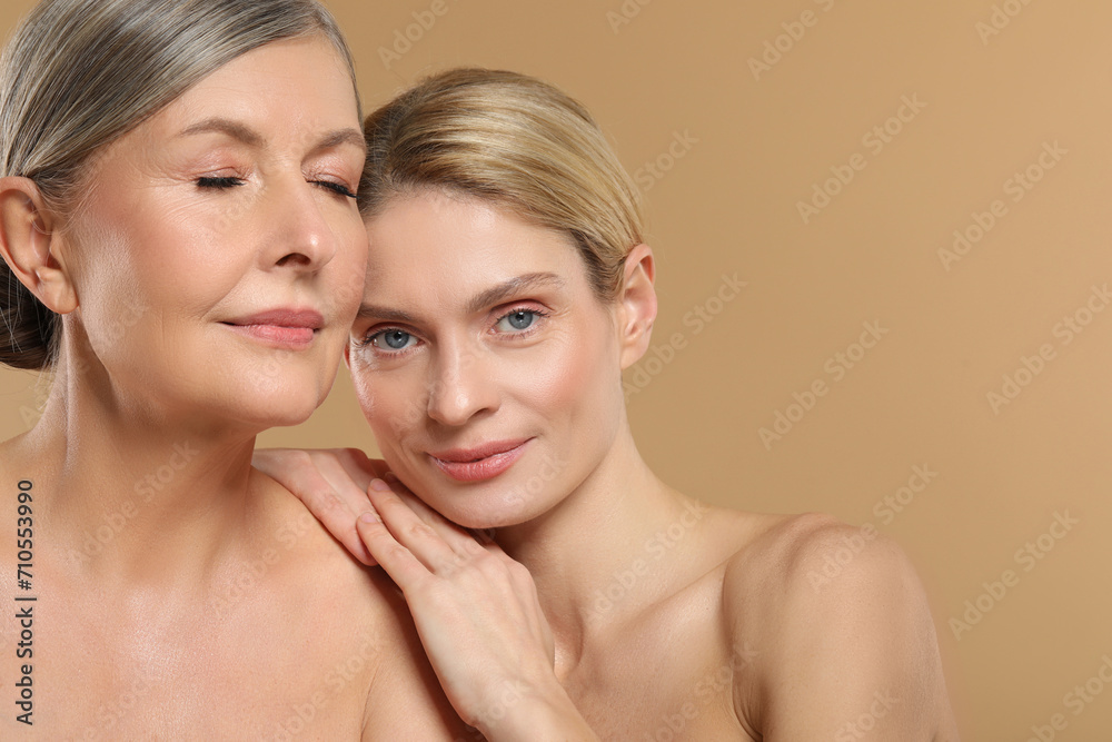 Beautiful women with healthy skin on beige background, space for text Beautiful women with healthy skin on beige background, space for text