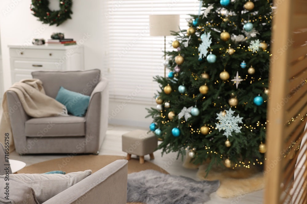 Christmas tree in room decorated for holiday. Festive interior design Christmas tree in room decorated for holiday. Festive interior design