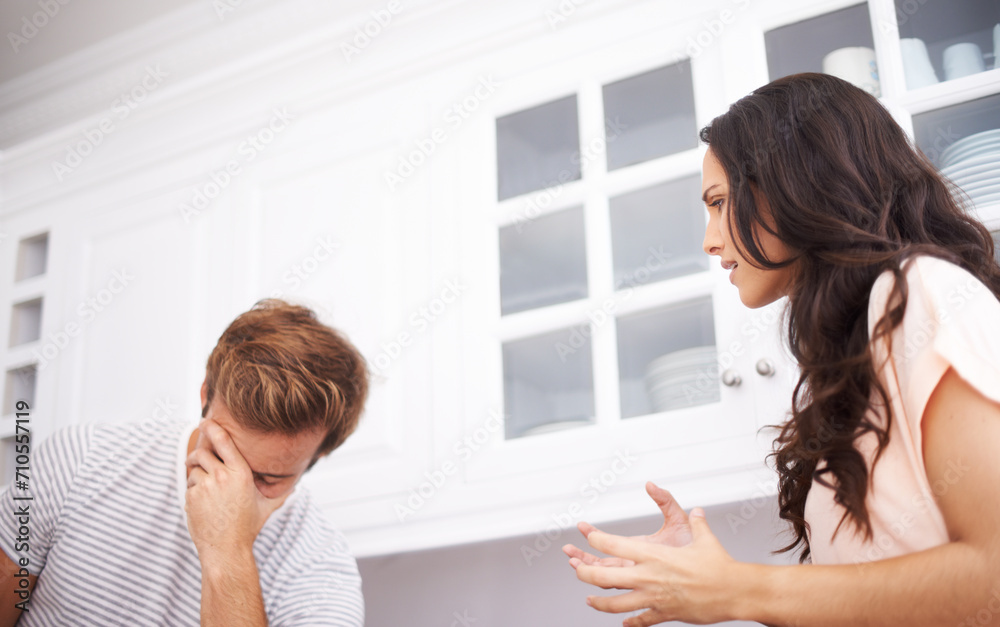 Couple, home and fight, angry and conflict with crisis in life, mistake or marriage fail with anxiety and stress. Frustrated people arguing in kitchen, cheating or problem with risk of divorce Couple, home and fight, angry and conflict with crisis in life, mistake or marriage fail with anxiety and stress. Frustrated people arguing in kitchen, cheating or problem with risk of divorce