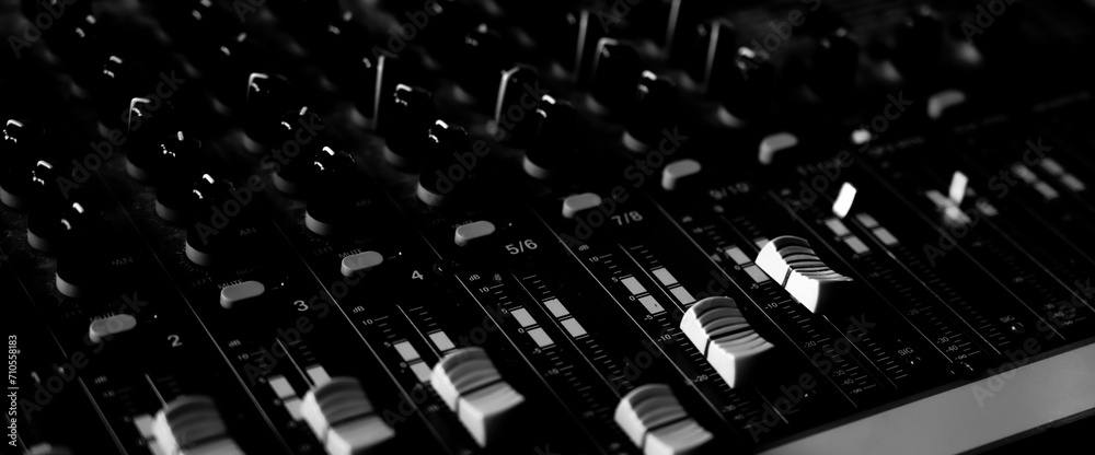 close up of a mixer sound control background with black and white background close up of a mixer sound control background with black and white background