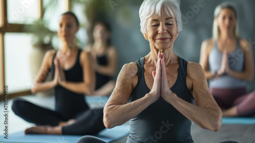 elderly gray-haired woman in sportswear at a yoga class, meditation, healthy lifestyle, old age, portrait, lady, sport, training, activity, wellness, hatha, Iyengar, mature person