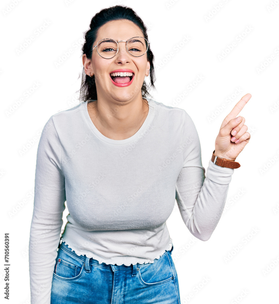 Young hispanic woman pointing with fingers to the side smiling and laughing hard out loud because funny crazy joke. Young hispanic woman pointing with fingers to the side smiling and laughing hard out loud because funny crazy joke.