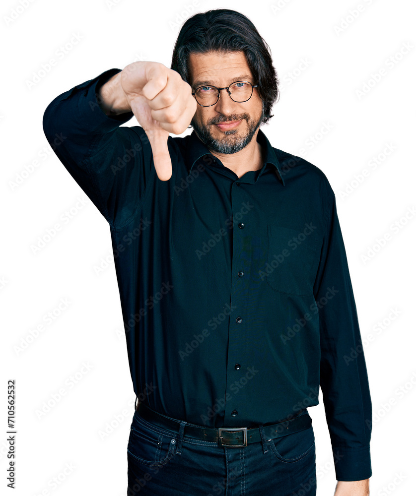 Middle age caucasian man wearing casual clothes and glasses looking unhappy and angry showing rejection and negative with thumbs down gesture. bad expression. Middle age caucasian man wearing casual clothes and glasses looking unhappy and angry showing rejection and negative with thumbs down gesture. bad expression.