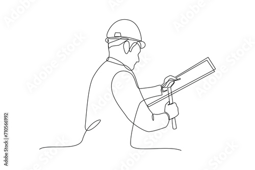 Continuous one line drawing the worker is nailing wood. Construction worker in uniform and helmet doing work. Builder concept. Repair work services. Single line draw design.