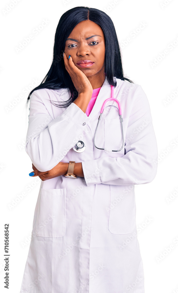 Young african american woman wearing doctor stethoscope thinking looking tired and bored with depression problems with crossed arms.