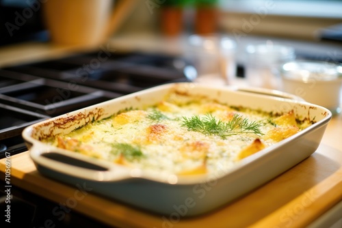 gratin dauphinois in the oven with melting cheese on top