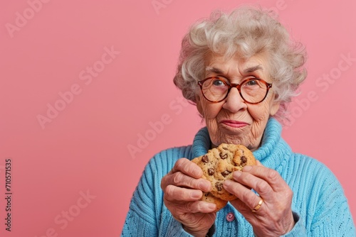 Elderly Woman Holding Cookie