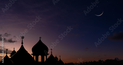 Silhouette dome mosques on twilight sky and crescent moon  Religious of Islamic well space for text Ramadan Kareem  Eid Al Adha  Eid Al Fitr  Eid Mubarak  Muharram 