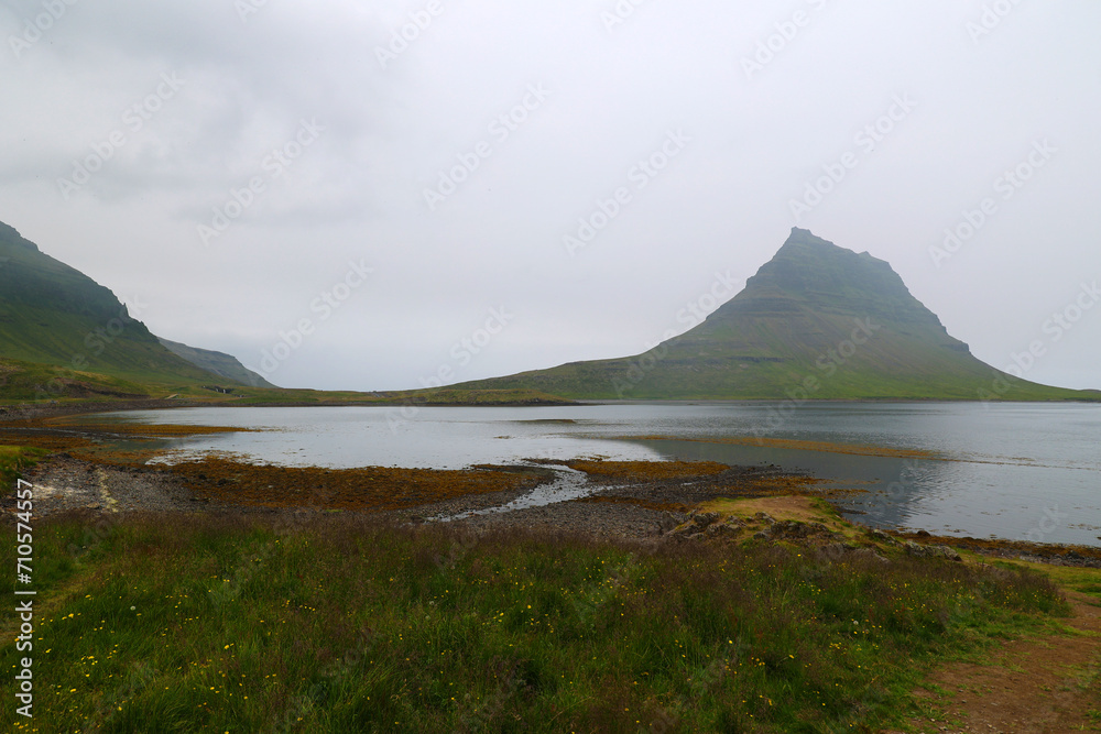 Iceland-View of Kirkjufell Mountain in Grundarfjordur fjord rising out of the fog 