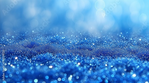 Abstract sparkling blue glitter background with bokeh lights