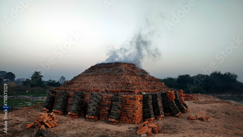 Photos Traditional brick making kiln in an Indian village at morning time in winter