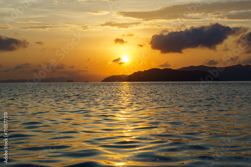 Peaceful rising sun over mountain shine over the ocean