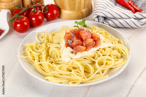 Pasta spaghetti with salmon and stracciatella