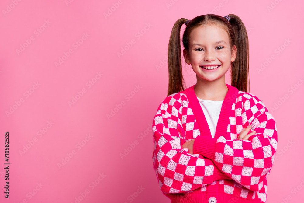 Photo of lovely cute girl wear stylish clothes standing with crossed arms presenting empty space novelty isolated on pink color background Photo of lovely cute girl wear stylish clothes standing with crossed arms presenting empty space novelty isolated on pink color background