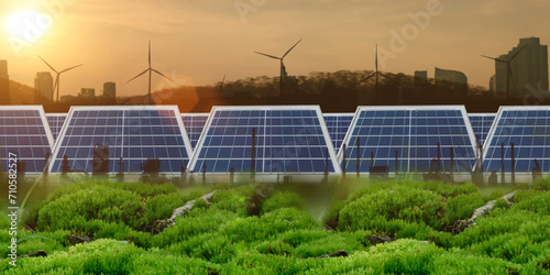 Double exposure graphic renewable energy concept. Solar panels with wind turbines and an environmentally friendly city. Sustainable growth, Earth Day net zero business, climate change. green business