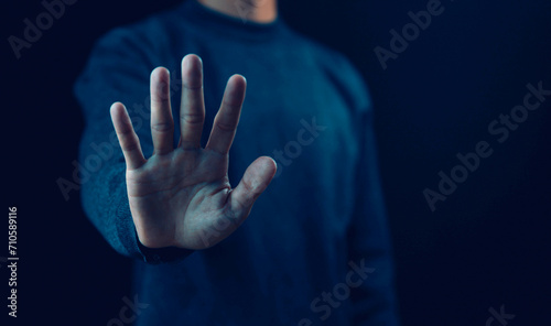 person's hand showing palm gestures stop concepts of violence, warning, refuse, and defense. the hand sign of men a stop, caution 