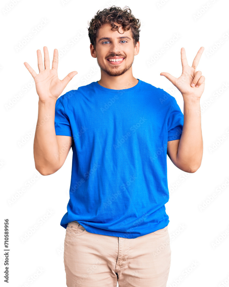 Young handsome man with curly hair wearing casual clothes showing and pointing up with fingers number eight while smiling confident and happy.