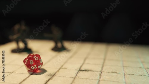 Playing a fantasy tabletop role-playing game with a D20 dice photo