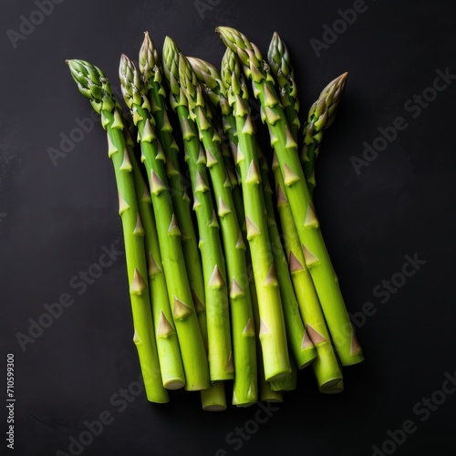 freh asparagus on dark stone surface