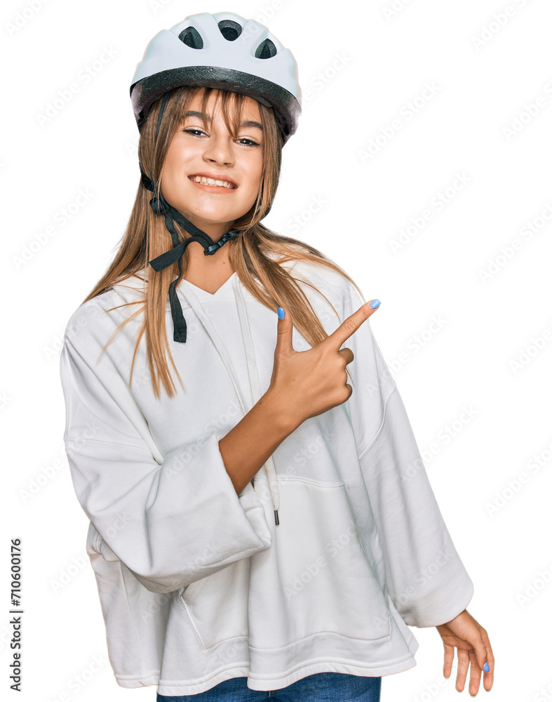 Teenager caucasian girl wearing bike helmet cheerful with a smile of face pointing with hand and finger up to the side with happy and natural expression on face Teenager caucasian girl wearing bike helmet cheerful with a smile of face pointing with hand and finger up to the side with happy and natural expression on face